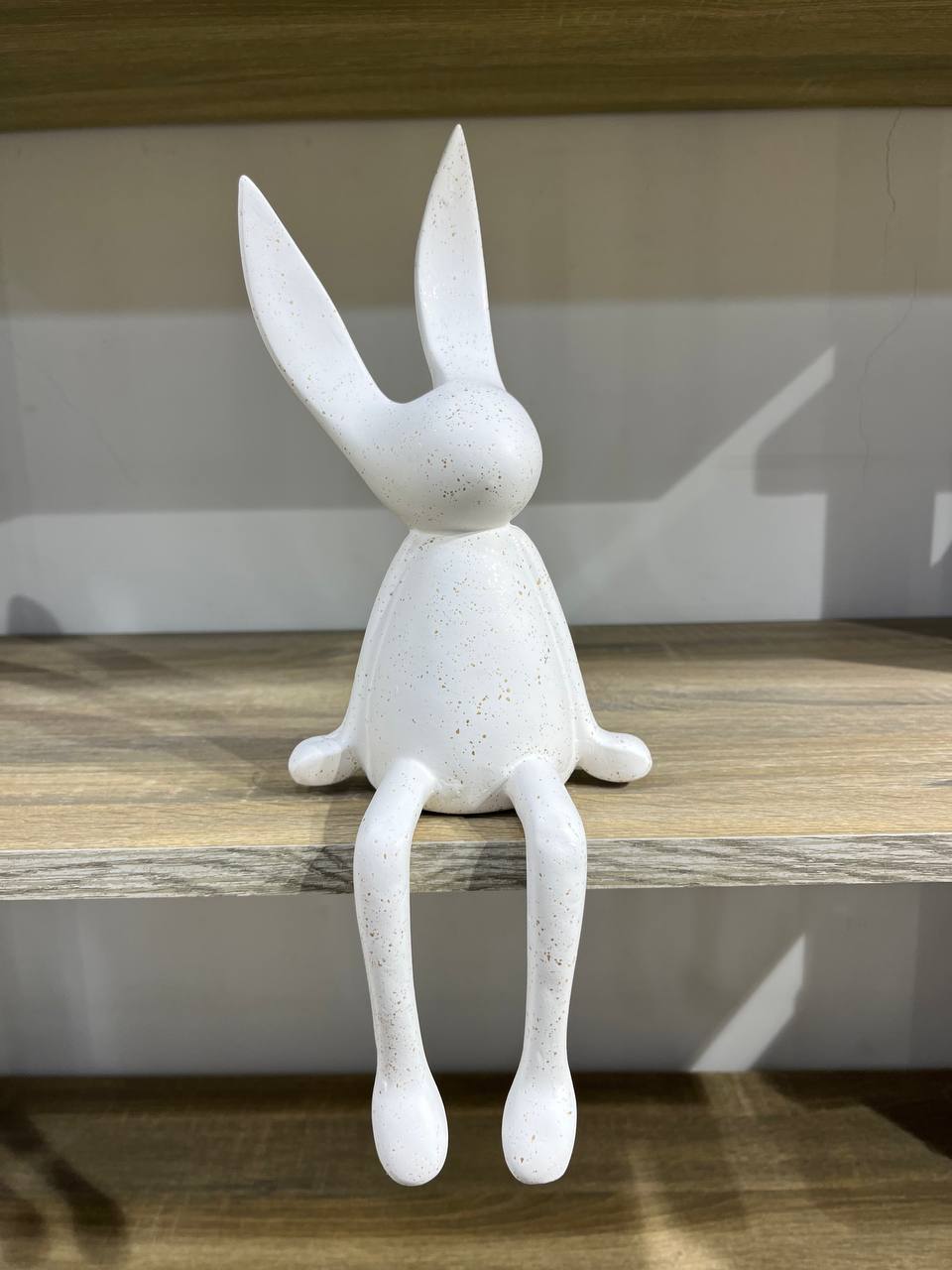 A rabbit sitting on polyester fabric