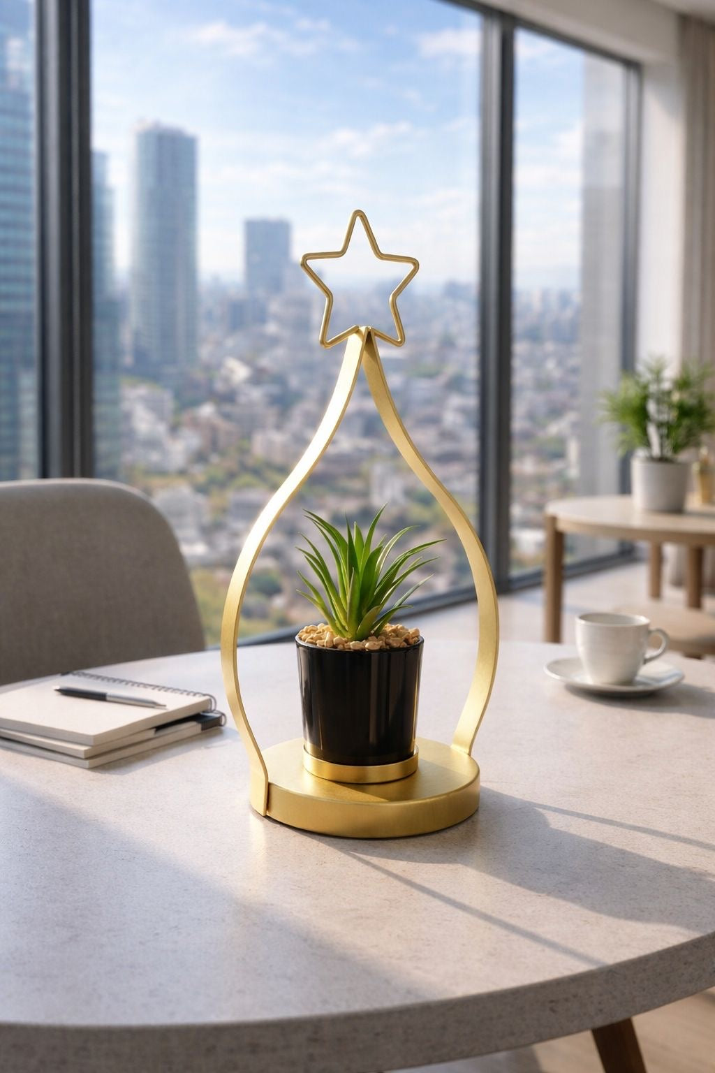 A chic cactus pot with a gold metal stand