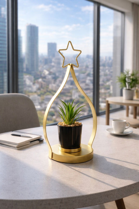 A chic cactus pot with a gold metal stand