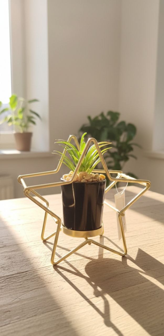 A chic cactus pot with a gold metal stand