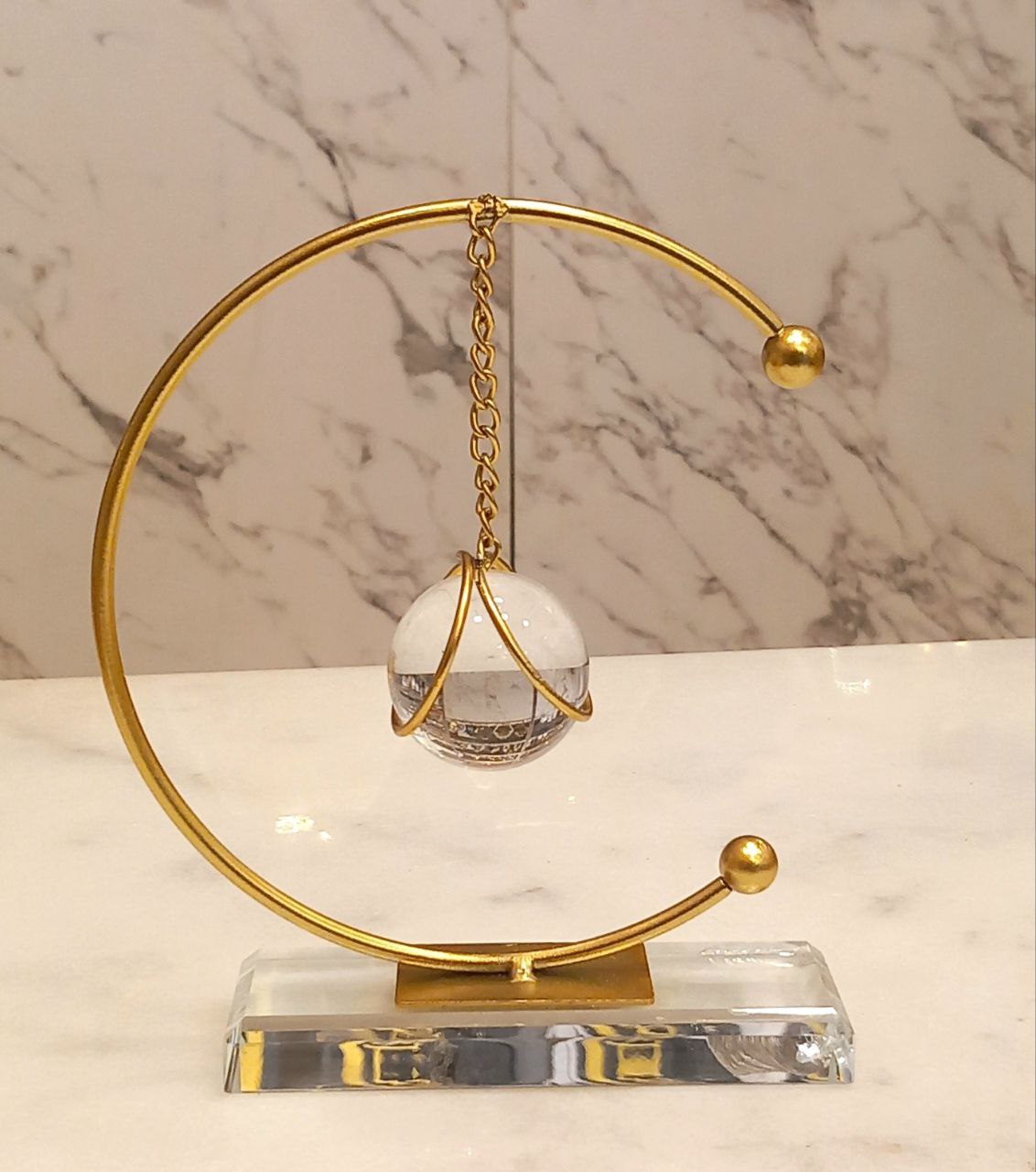 Pendulum with crystal base