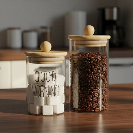 A jar of spices, tea, sugar, and coffee.   Round
