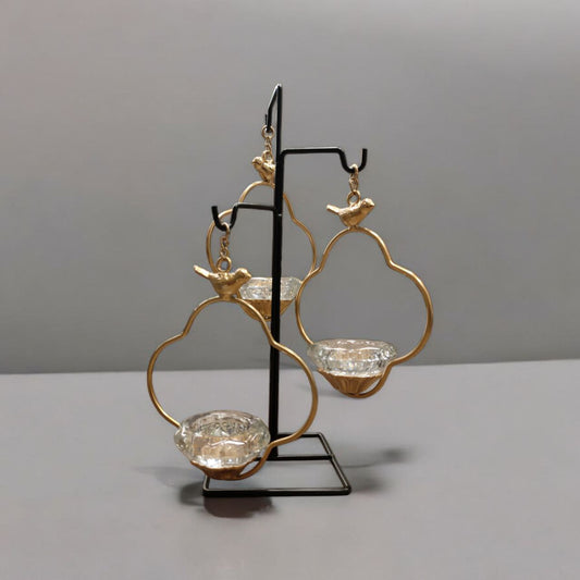 Three-legged bird candle holder