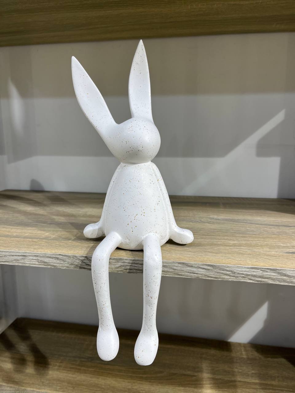 A rabbit sitting on polyester fabric
